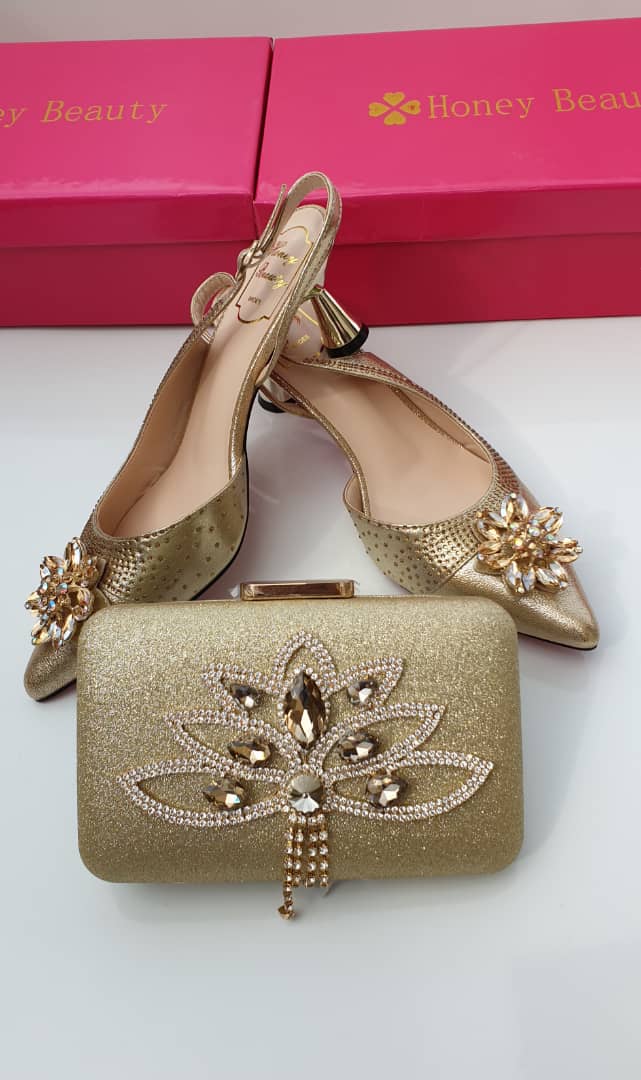 gold shoes and clutch bag